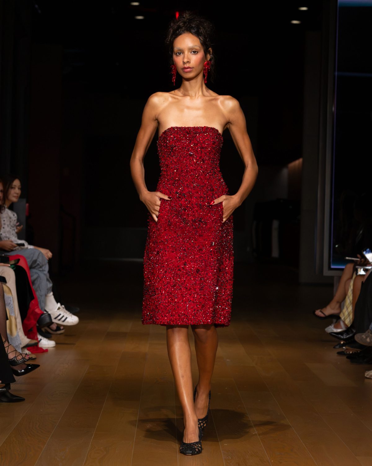 Red sequin strapless cocktail dress with matching earrings and woven black heels.