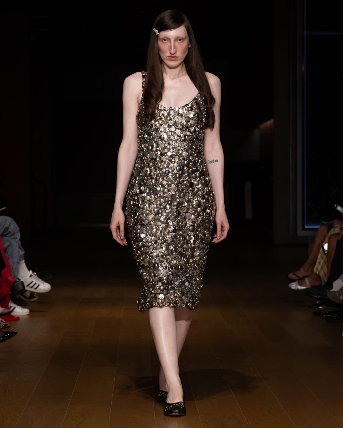 Metallic button-embellished slip dress with sheer hosiery and black woven flats.