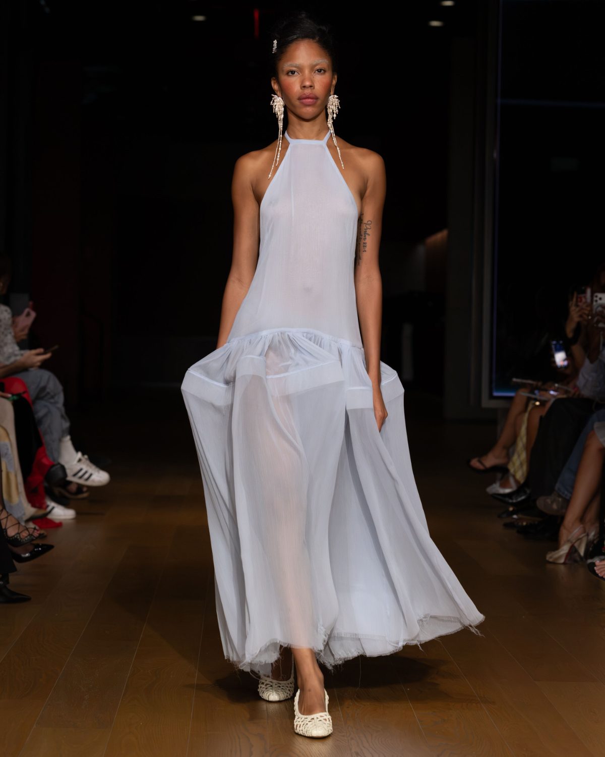 Sheer light blue halter maxi dress with long pearl drop earrings and white woven flats.