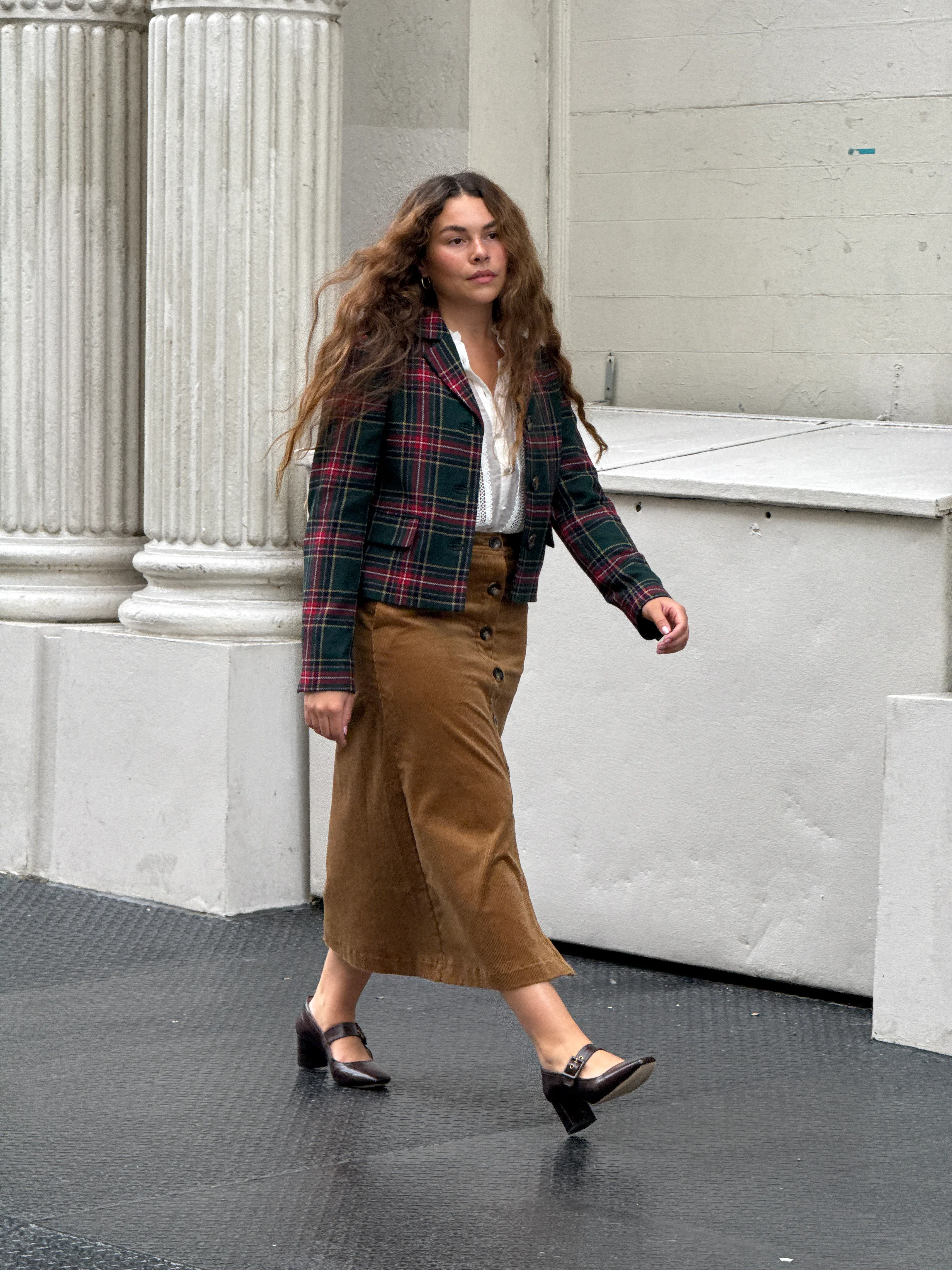 Green plaid blazer, white top, and brown corduroy skirt with mary jane heels.